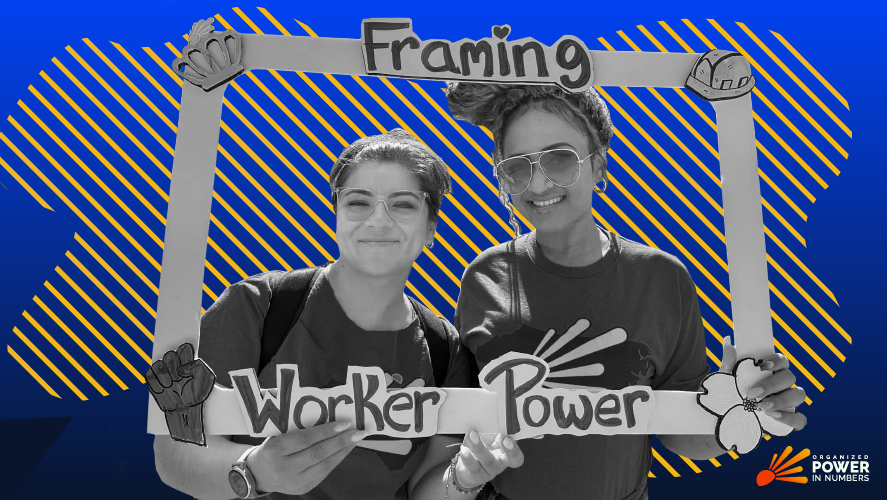 Two young women hold a frame around them that reads framing workers over billionaires